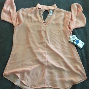 Peach colored blouse